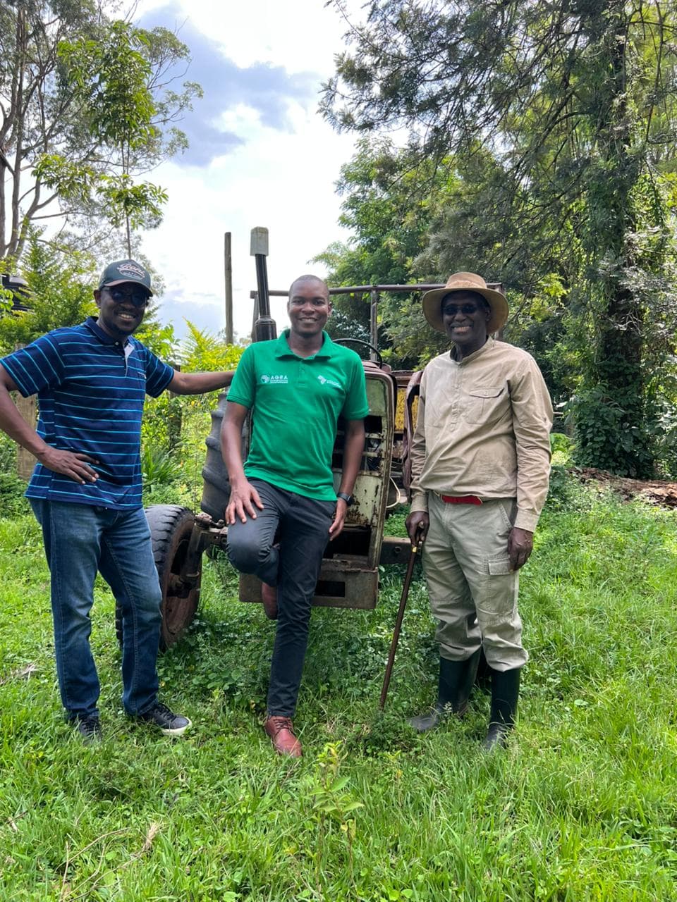 Leadership team with farm equipment